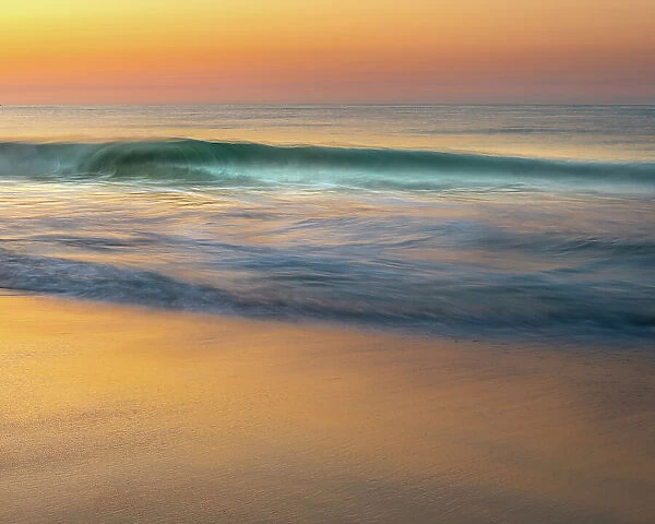 USA, New Jersey, Cape May National Seashore. Wave on beach at sunrise. Date: 21-05-2021