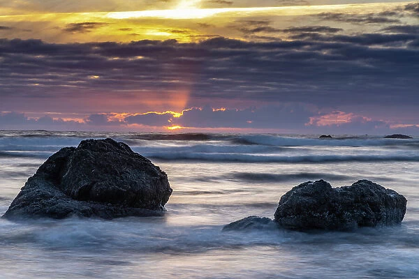 USA, Oregon, Bandon Beach. Pacific Ocean shoreline at sunset. Date: 25-05-2021