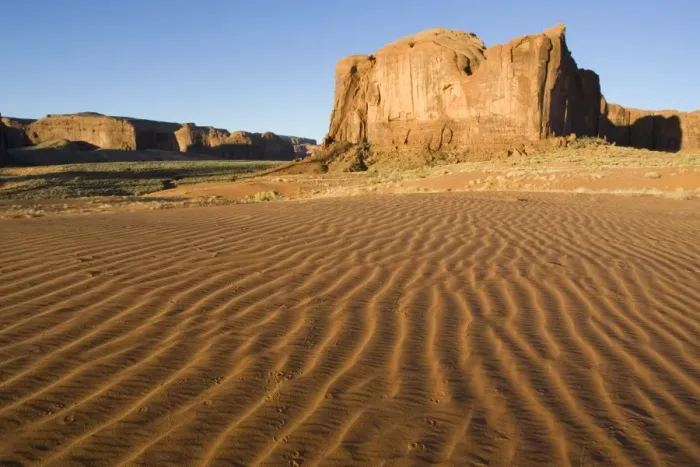 Framed Print : USA - Structural forms in the sand against the background of a sandstone mesa in the southern part of the Monument Valley. Monument Valley Navajo Tribal Park, Navajo Nation, Arizona / Utah, USA Framed Print : USA - Structural forms in the sand against the background of a sandstone mesa in the southern part of the Monument Valley. Monument Valley Navajo Tribal Park, Navajo Nation, Arizona / Utah, USA