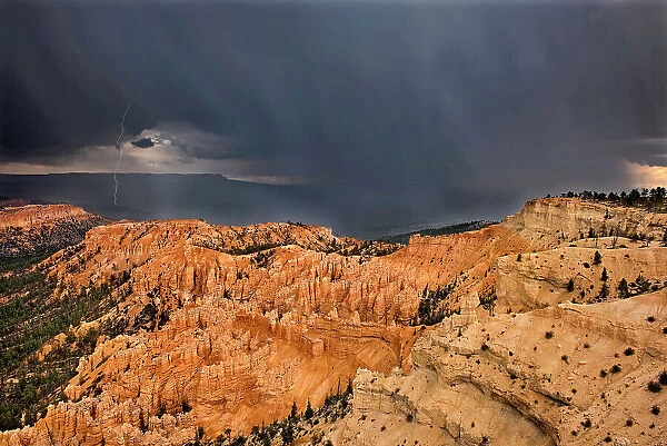 USA, Utah, Bryce Canyon National Park. Sunrise on storm clouds and sandstone hoodoo formations. Date: 03-08-2010