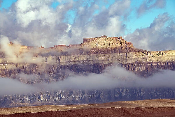 USA, Utah. Green River, Cloud and Mist Shrouded Little Elliot Mesa, Transportation Rock Date: 09-10-2021