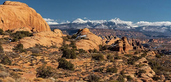 USA, Utah. Vista of sandstone formations in the Sand Flats Recreation Area with La Sal Mountain Range in the background, near Moab. Date: 20-01-2021