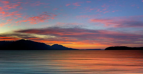 USA, Washington State, Seabeck. Composite panoramic sunset over Hood Canal. Date: 06-07-2021