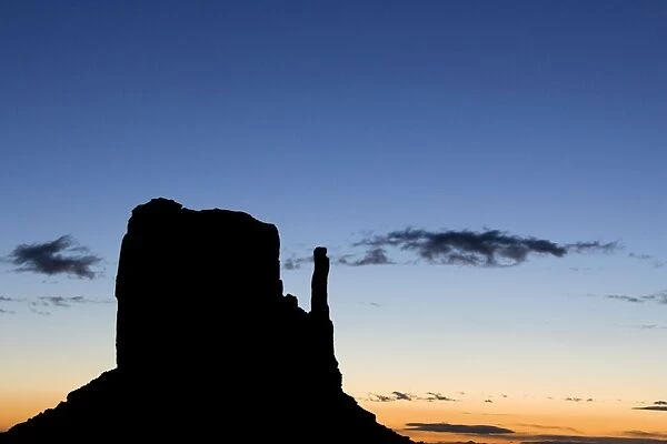USA - West Mitten Butte is one of the most prominent and photogenic landmarks of the Monument Valley, the classic Wild-West landscape of sandstone buttes and pinnacles of rock; at dawn. Monument Valley Navajo Tribal Park, Navajo Nation