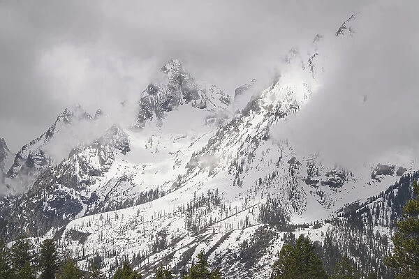 USA, Wyoming, Grand Teton National Park. Clouds over mountains during spring snowstorm. Date: 04-05-2021