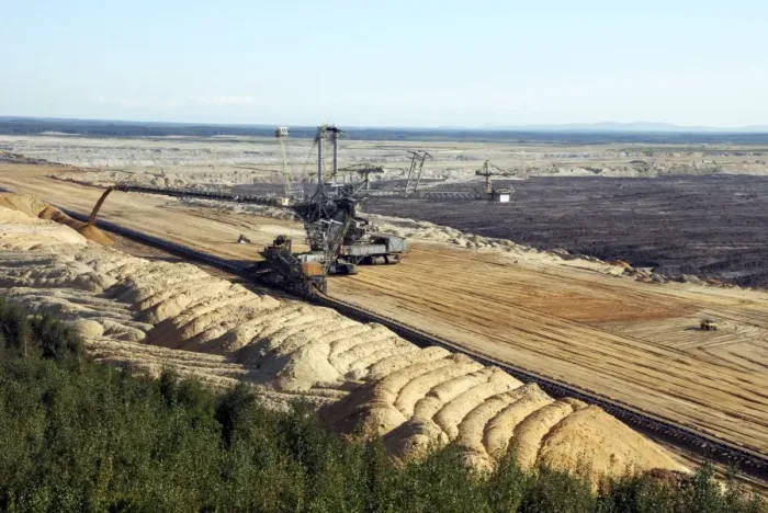 Framed Print : Vattenfall Europe Opencast brown coal (lignite) mine and simultaneous backfilling - near Weisswasser - Saxony NE Germany. (note the bulldozer in front of the big excavator for scale object)