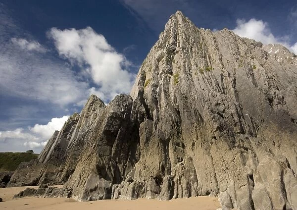 Vertical folded limestone strata, at Three Crowns Bay, Gower peninsula