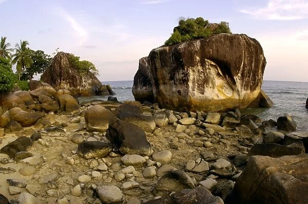 Volcanic boulders on a beach of Tioman Island, 30 km east off peninsula Malaysia in South China Sea; evening in June. Ma39. 3839