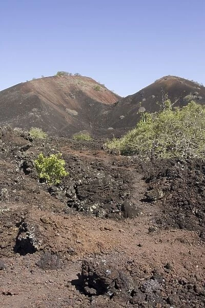 Volcanic - Chaimu lava flow with volcanic cones in background Tsavo National Park, West Kenya, East Africa
