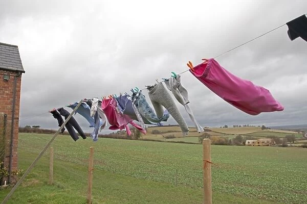 Washing line of clothes blowing in high wind - Mickleton - Gloucestershire - UK