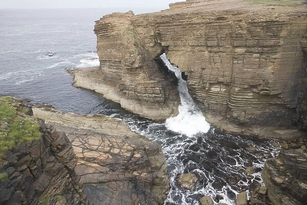 Water flowing through Sea Arch - Yesnaby Cliffs - Mainland Orkney LA005169
