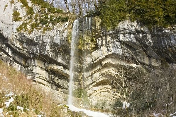 Waterfall over folded Jurassic limestone strata - the Chapeau de Gendarme - near Pontarlier, Jura Mountains, east France