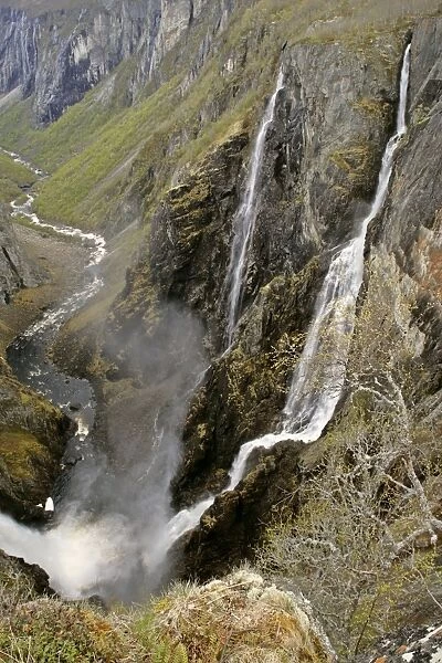 waterfalls view of the thundering water masses of Voringfossen and Simadalen in early spring Voringfossen, Hardangervidda, Fjord-Norway, Norway
