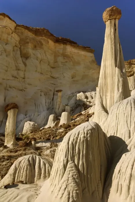 Framed Print : White Ghosts - the Wahweap Hoodoos are white pedestral rocks of silt-stone some of them topped by brown rocks - pedestrals are eroded by water creating an intricate pattern of vertical furrows Framed Print : White Ghosts - the Wahweap Hoodoos are white pedestral rocks of silt-stone some of them topped by brown rocks - pedestrals are eroded by water creating an intricate pattern of vertical furrows