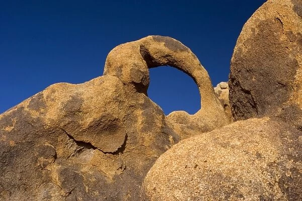 Whitney Portal Arch - amazing rock arch of red granite situated at the foothills of the Sierra Nevada - Alabama Hills Recreation Area, California, USA
