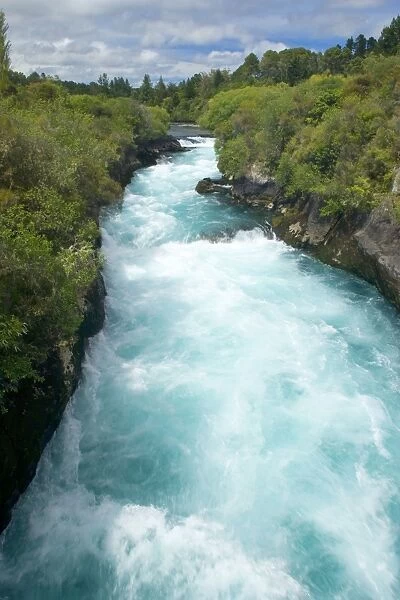 Wildwater river water masses of Waikato river rushing down a gorge towards Huka Falls Taupo, North Island, New Zealand