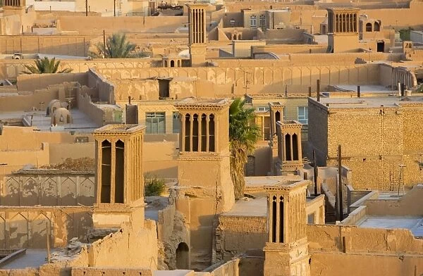 Wind towers, Yazd, Iran. The old town of Yazd showing wind towers, designed to catch breezes and funnel them down into the homes below as a form of cooling