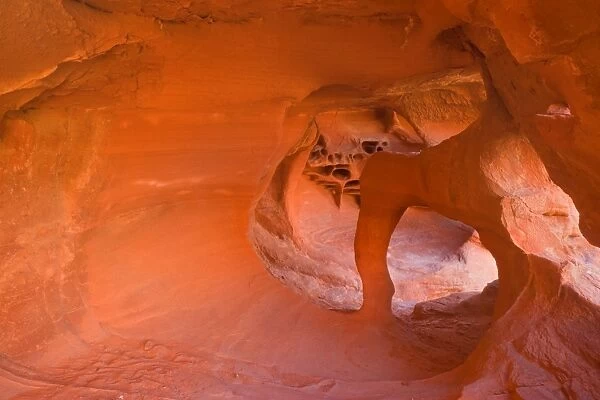 Windstone - erosion sculpted arch inside a cave-like alcove of bright red sandstone - Valley of Fire State Park - Nevada - USA
