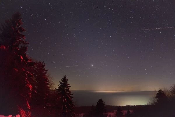 Winter sky - showing stars and airliner jet light trails - Hoher Meissner National park - North Hessen - Germany