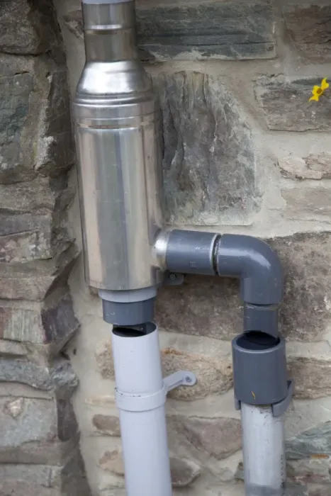 Framed Print : Wisey stainless steel rain water diverter and filter installed in downpipe of eco house UK Framed Print : Wisey stainless steel rain water diverter and filter installed in downpipe of eco house UK