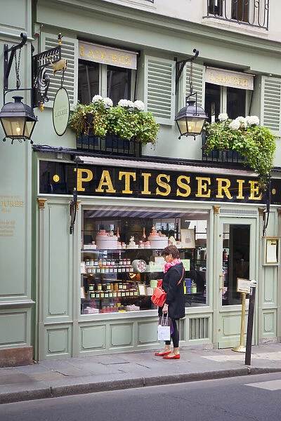 Woman window shopping at Lauderee Patisserie