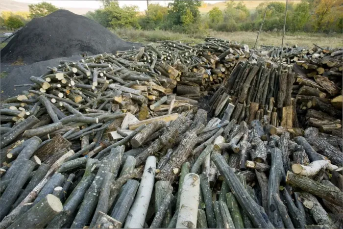 Framed Print : Wood-pile in the traditional charcoal-burner's yard at Viscri saxon village, Transylvania, Romania