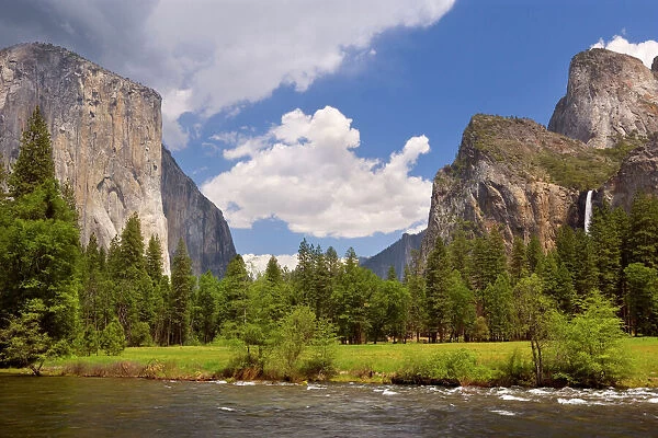 Yosemite Valley with Merced River in the foreground, Bridal Veil Falls on the right hand side and the sheer granite face of El Capitan on the left hand side. In spring - Yosemite National Park, California, USA