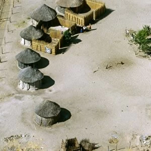 Aerial view of thatched rondavels made of mud and straw in a typical African village. Maun, Botswana