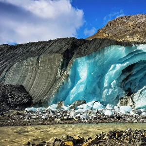 Blue ice and meltwater at the toe of the Athabasca Glacier, Jasper National Park, Alberta, Canada Date: 25-05-2021