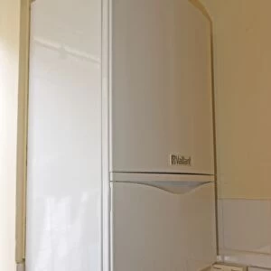 Boiler - vaillant EcoTec modern combination or compact combi boiler installed in small flat produces instant hot water UK