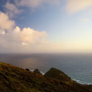 Cape Reinga northernmost tip of New Zealand with Cape Reinga Lighthouse in first morning light Northland, North Island, New Zealand