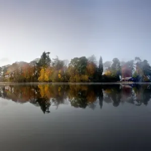 Derwent Island - autumn reflections in derwent water on a calm misty morning - Lake District - England Derwent Island - autumn reflections in derwent water on a calm misty morning - Lake District - England