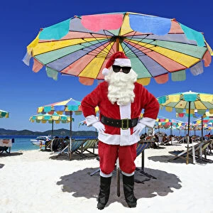 Father Christmas / Santa Claus on beach, Khai Nai Island, Phuket, Thailand