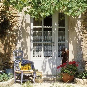 France Blue chair & vine & net-curtained white door, Provence
