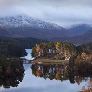 Glen Affric - cottage in early morning sunshine on a calm autumn morning on Loch Affric - November - Scotland