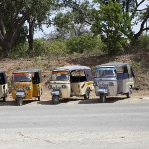 Line of Tuk-Tuk three wheeled motorised rickshaw taxis waiting for passengers Kilifi - Kenya