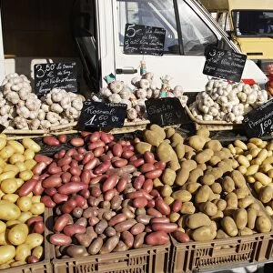 Market - Vegatable stall selling garlic and a variety of potatoes. Nice - France