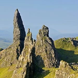 Old Man of Storr bizarre rock formation Old Man of Storr and rolling green slopes Isle of Skye, Western Highlands, Scotland, UK