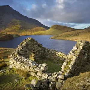 Old ruin over looking Llyn Dwyarchen in beautiful stormy light - North Wales - UK Old ruin over looking Llyn Dwyarchen in beautiful stormy light - North Wales - UK