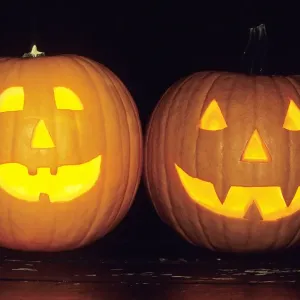 Pumpkins - 2 decorated and lit up from inside with candles, as Halloween lanterns, Lower Saxony, Germany