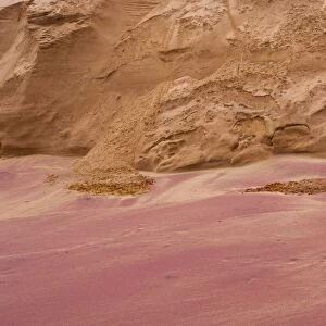 Purple garnet sand (semi-precious mineral) on the wild deserted coast south of Walvis Bay on the Atlantic coast of Namibia