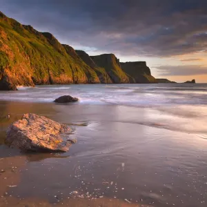 Rhossili - beach at sunset - Worms Head, Gower, Wales, UK Rhossili - beach at sunset - Worms Head, Gower, Wales, UK