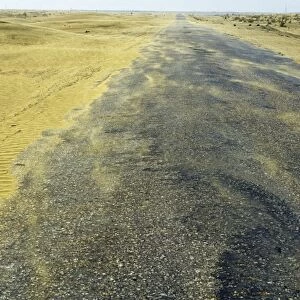 Sand dunes in a wind - Karakum desert encroach on a road - near Kumdag - Turkmenistan - former CIS - Spring - April Tm31. 0372