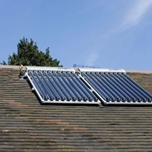 Solar thermal panels with evacuated tubes on roof of Worcestershire House provide domestic hot water UK