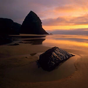 Sunset at beach of Bedruthan Steps at low tide Bedruthan Steps, Cornwall, England, UK