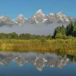 Teton Range reflected in still waters of the Snake River at Schwabacher Landing, Grand Teton National Park, Wyoming. Date: 13-09-2019 Teton Range reflected in still waters of the Snake River at Schwabacher Landing, Grand Teton National Park, Wyoming. Date: 13-09-2019