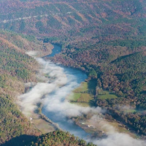 USA, Tennessee. Morning fog Hiwassee River, Blue Ridge fall color Date: 08-11-2020