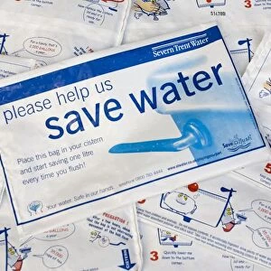 Water conservation - placing water hippo saveaflush bags, provided free by Severn Trent Water, in toilet cistern helps conserve water each time the toilet is flushed. UK