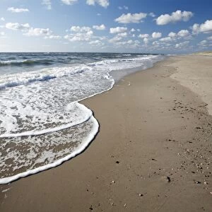 Waves breaking on empty beach, Island of Texel, Holland