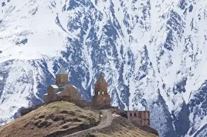 Caucasus Prints: 14th century Gergeti Trinity Church (Georgian Orthodox) high in the mountains above Stepantsminda